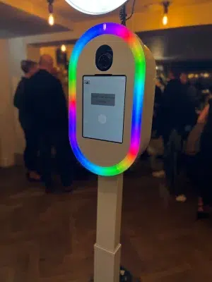Modern Selfie Pod photo booth with colourful LED ring light and touchscreen