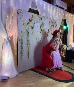 Wedding photo booth with elegant flower wall backdrop