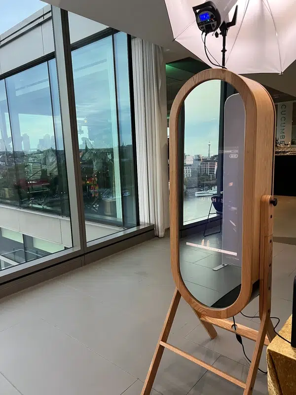 Retro Mirror Booth facing floor-to-ceiling windows with London skyline